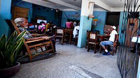 Open air cafe in downtown Havana where patrons can view state run TV; there's no satellite here